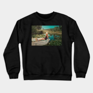 woman floating among waterlilies Crewneck Sweatshirt